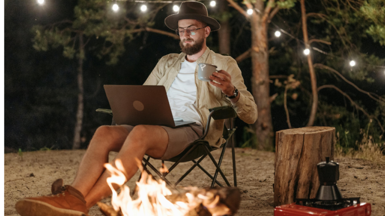 man camping with laptop freelancing with no experience