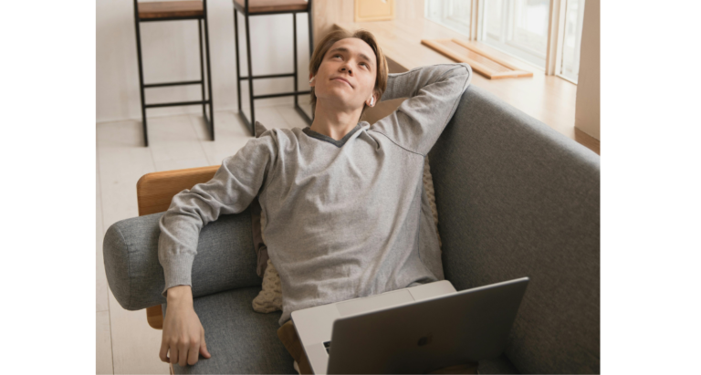 freelancer relaxing on couch as a side hustler